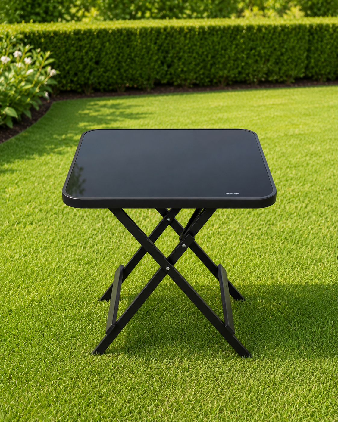The Onyx Glass Folding Patio Table